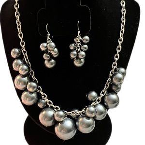 Silver colored bead necklace and earring set